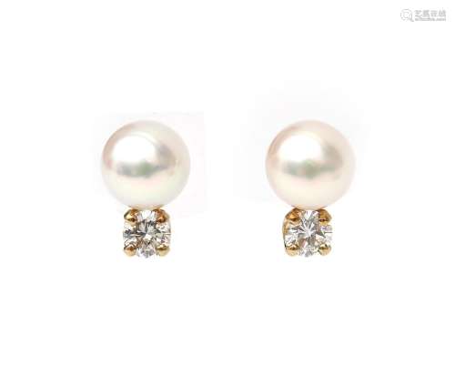 A pair of 14 karat gold pearl and diamond earrings, ca. 0.50...