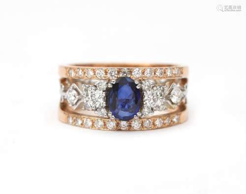 An 18 karat gold sapphire and diamond decachord ring. A wide...