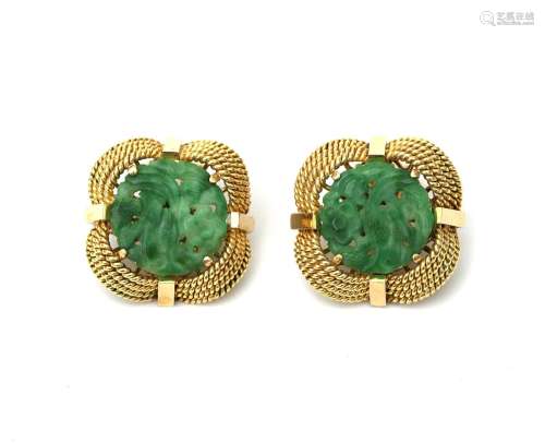 A pair of 14 karat gold jadeite ear clips. Featuring floral ...