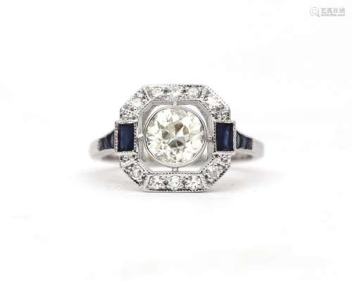 A 18 karat white gold diamond an sapphire ring. Contemporary...