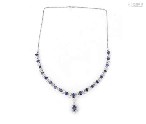 A 14 karat white gold sapphire and diamond necklace. Gross w...