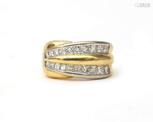 An 18 karat two tone diamond set band. A wide band featuring...