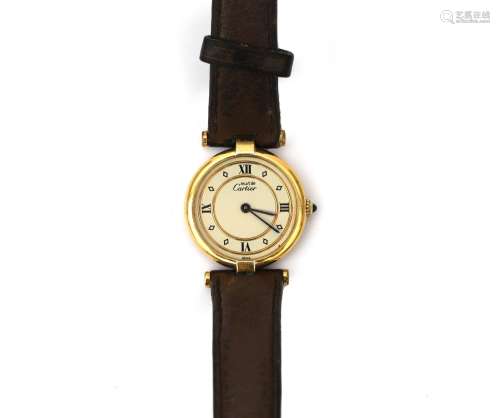 A silver vermeil Must de Cartier lady`s wristwatch. Quartz, ...