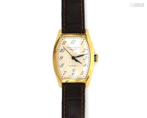 An 18 karat gold Longines Tonneau Evidenza lady`s wristwatch...