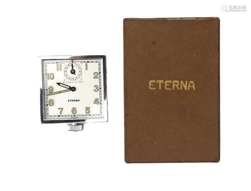 A steel Eterna automobile clock, ca. 1950. 8 days alarm, Inc...