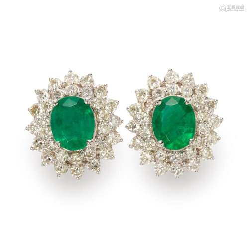 A pair of emerald, diamond and eighteen karat white gold ear...