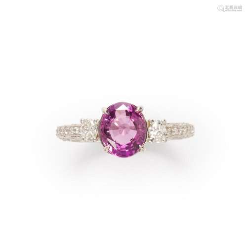 A pink sapphire, diamond and platinum ring