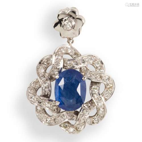 A sapphire, diamond and eighteen karat white gold pendant