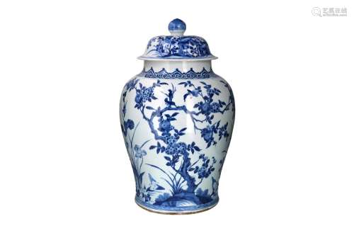 A blue and white porcelain lidded vase, decorated with flowe...