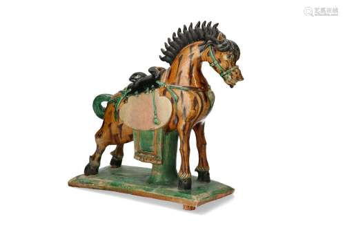 A sancai earthenware sculpture of a saddled horse. Unmarked....