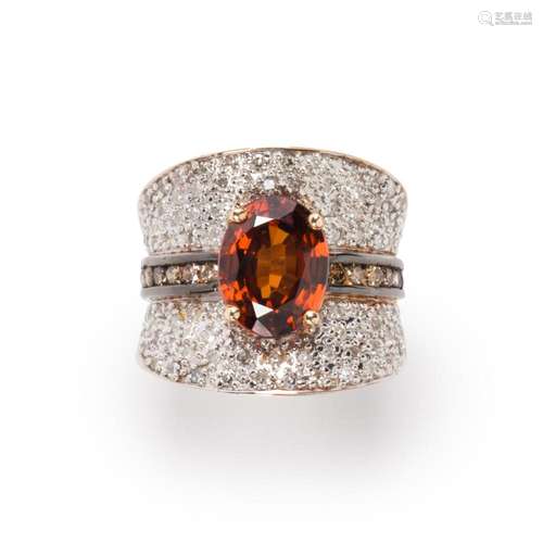 An orange zircon, diamond and fourteen karat bi-color gold r...