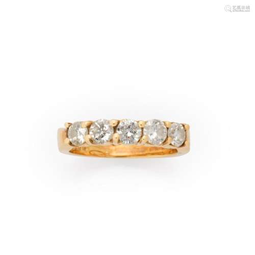 A diamond and fourteen karat gold ring