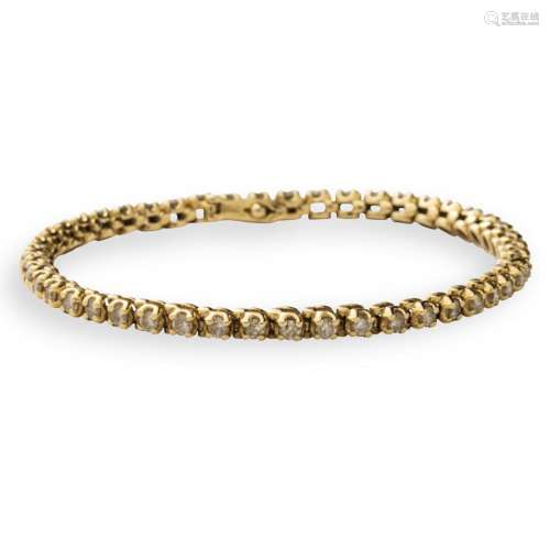 A diamond and fourteen karat gold bracelet