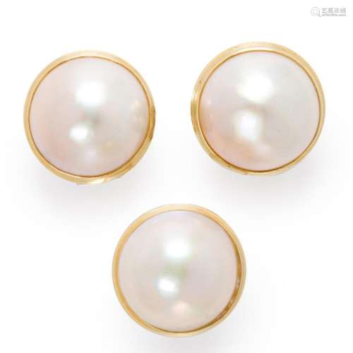A pair of mabé pearl and fourteen karat gold earclips and ri...