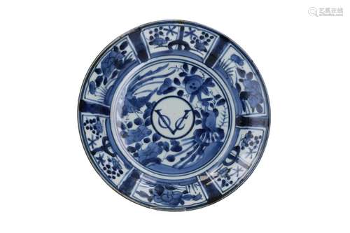 A blue and white porcelain dish, decorated with flowers and ...