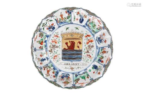 A polychrome porcelain lobed armorial dish with scalloped ri...