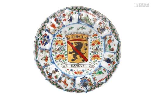 A polychrome porcelain lobed armorial dish with scalloped ri...