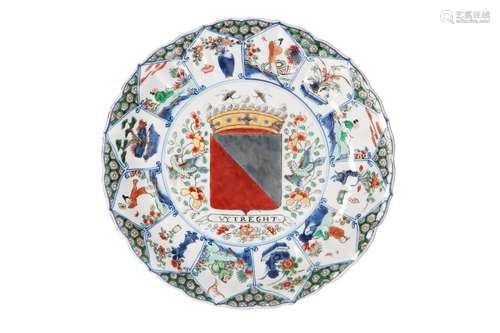 A polychrome porcelain lobed armorial dish with scalloped ri...