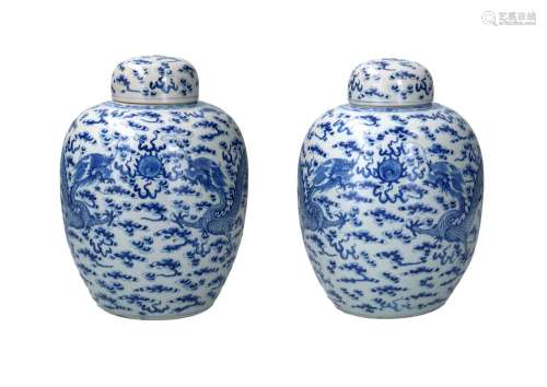 A pair of blue and white porcelain lidded jars, decorated wi...
