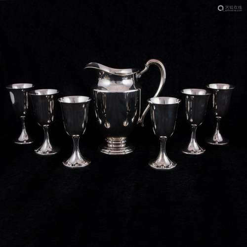 An International sterling water pitcher and six water goblet...