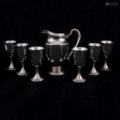 An International sterling water pitcher and six water goblet...