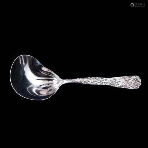 A Tiffany Vine casserole spoon with oyster or kidney shape b...
