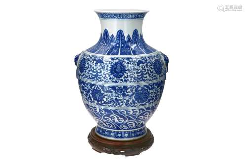 A blue and white porcelain Hu vase on wooden base, decorated...