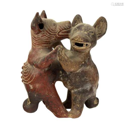 A Pre Columbian style ceramic figural group of dancing dogs