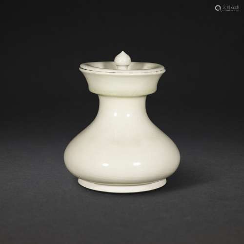 A WHITE-GLAZED COMPRESSED PEAR-SHAPED JAR AND COVER