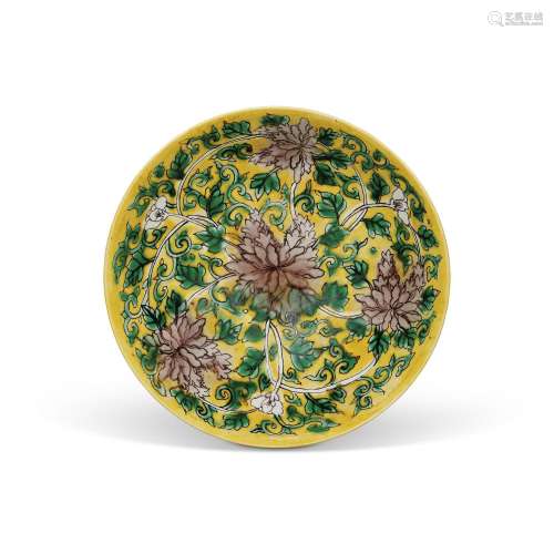 AN AUBERGINE AND GREEN-ENAMELLED YELLOW-GROUND SHALLOW BOWL