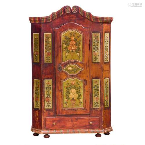 A Continental folk art painted marriage cupboard