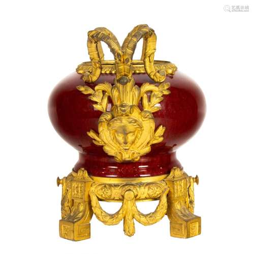 A French gilt bronze mounted Chinese sang de boeuf porcelain...