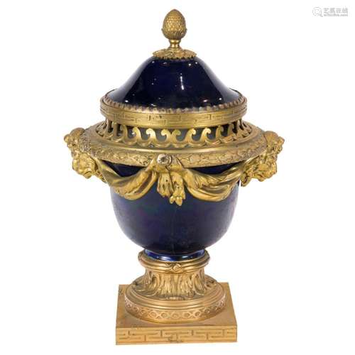 A Louis XV style gilt bronze mounted porcelain potpourri urn...