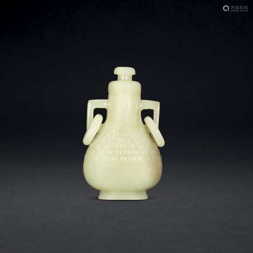 A SMALL YELLOW JADE VASE AND COVER