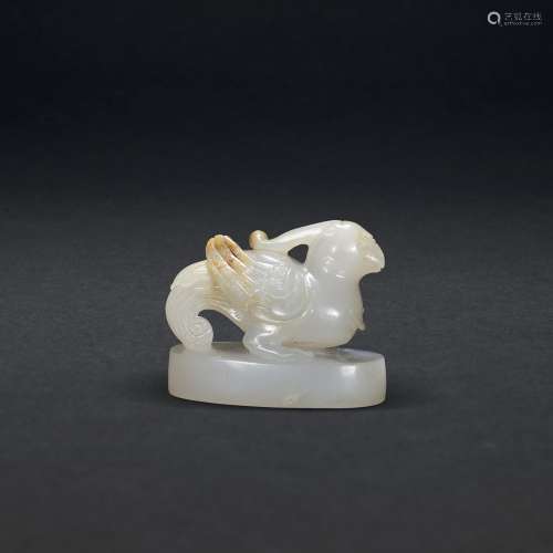 A CARVED WHITE JADE ‘MYTHICAL BIRD’ FINIAL