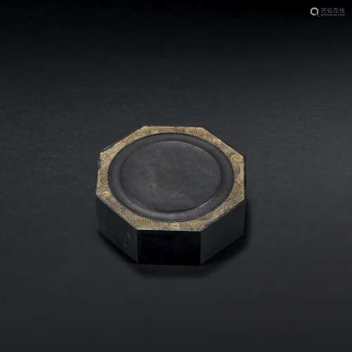 AN IMPERIAL MOULDED AND CARVED INKSTONE-SHAPED OCTAGONAL INK...