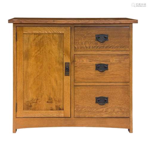 An Arts and Crafts style oak cabinet