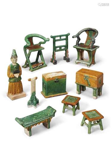 A GROUP OF 45 GREEN AND AMBER-GLAZED POTTERY FIGURES AND MOD...