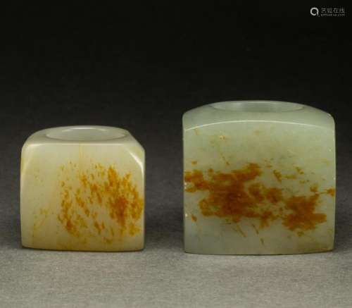 (lot of 2) Chinese celadon and russet jade archer's ring...