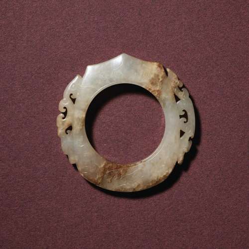 A WHITE JADE RETICULATED ARCHER’S RING, SHEWESTERN HAN DYNAS...