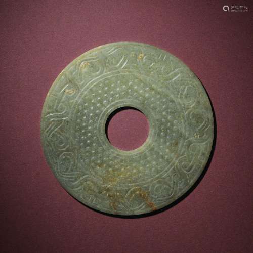 A CELADON JADE ‘DRAGON’ DISC, BIWESTERN HAN DYNASTY (206 BC-...