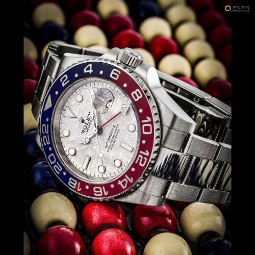 ROLEX. AN 18K WHITE GOLD AUTOMATIC DUAL TIME WRISTWATCH WITH...