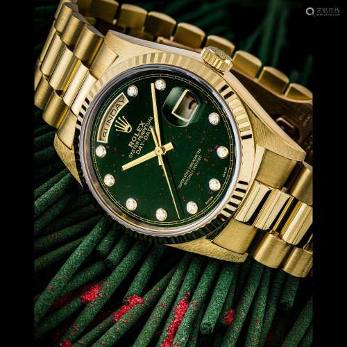 ROLEX. AN 18K GOLD AND DIAMOND-SET AUTOMATIC WRISTWATCH WITH...