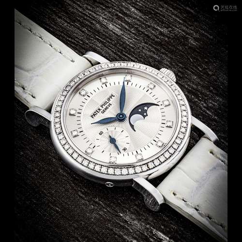 PATEK PHILIPPE. A LADY’S 18K WHITE GOLD AND DIAMOND-SET WRIS...