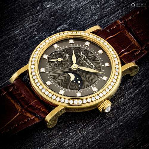 PATEK PHILIPPE. A LADY’S 18K GOLD AND DIAMOND-SET WRISTWATCH...