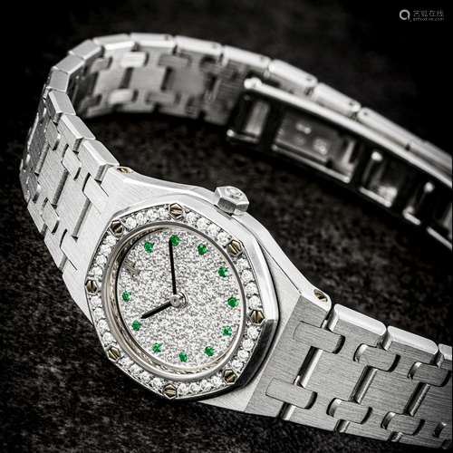 AUDEMARS PIGUET. A LADY’S 18K WHITE , GOLD , DIAMOND AND EME...