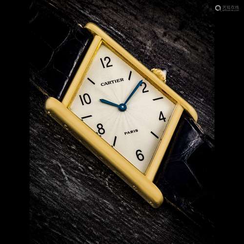 CARTIER. A RARE 18K GOLD LIMITED EDITION ASYMMETRICAL WRISTW...