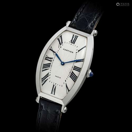 CARTIER. A PLATINUM TONNEAU-SHAPED WRISTWATCH2000s