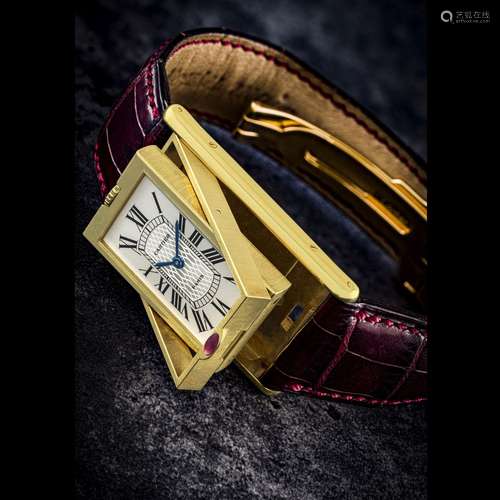 CARTIER. A RARE 18K GOLD LIMITED EDITION RECTANGULAR REVERSI...