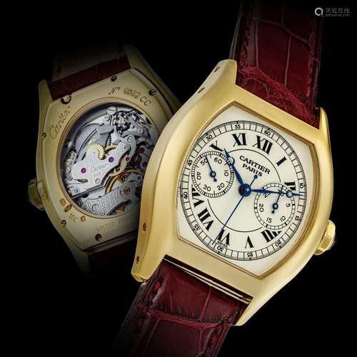 CARTIER. AN 18K GOLD TONNEAU SHAPE SINGLE BUTTON CHRONOGRAPH...